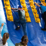 People on an inflatable climbing frame